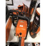 Stihl MS290 chainsaw; Stihl 25 chainsaw; safety helmet; and boots.