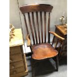 Victorian beech slat back elbow chair.