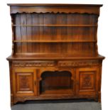 Late Victorian carved oak sideboard,