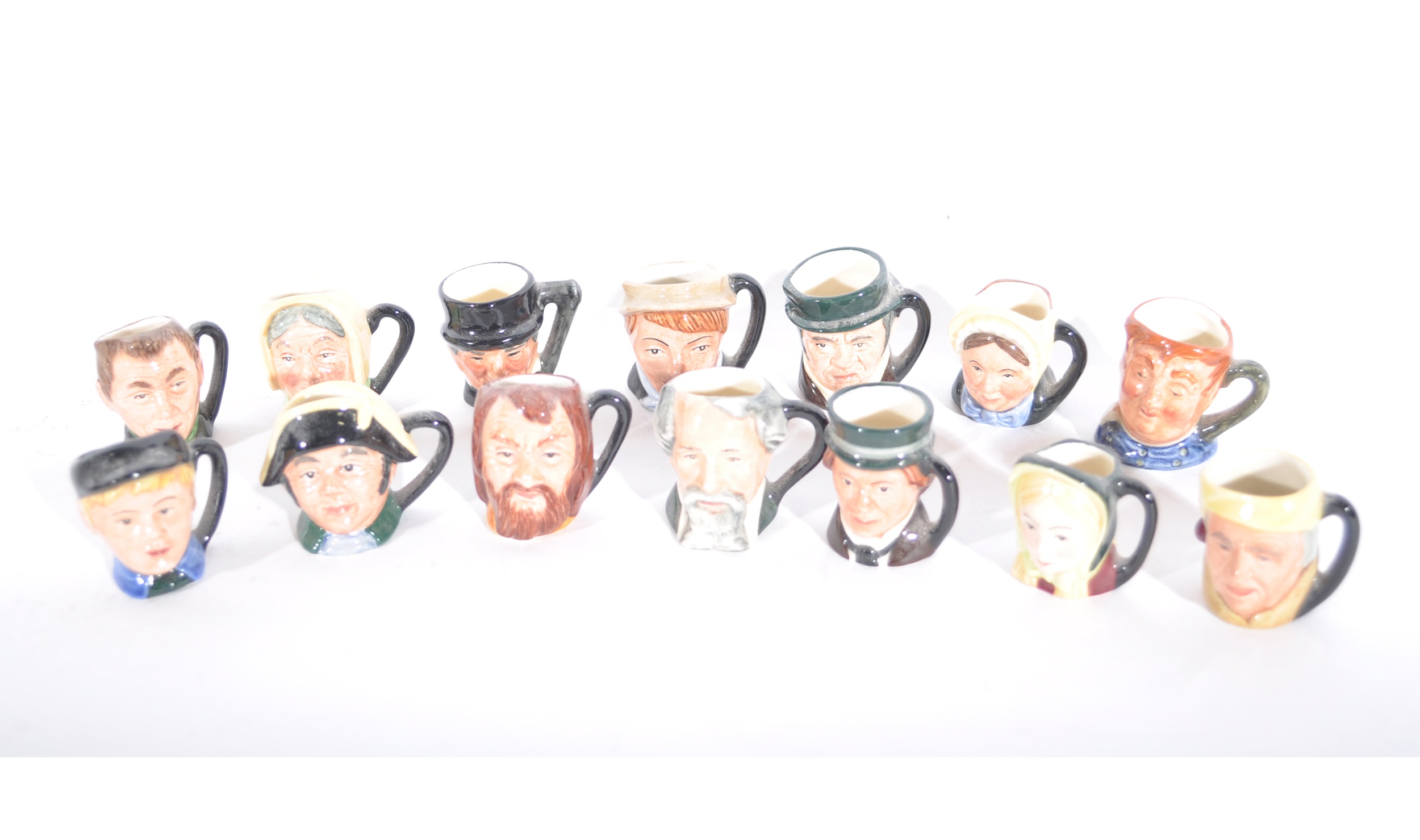 Fourteen Royal Doulton miniature character jugs