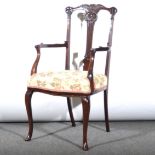 A Victorian carved mahogany salon elbow chair,