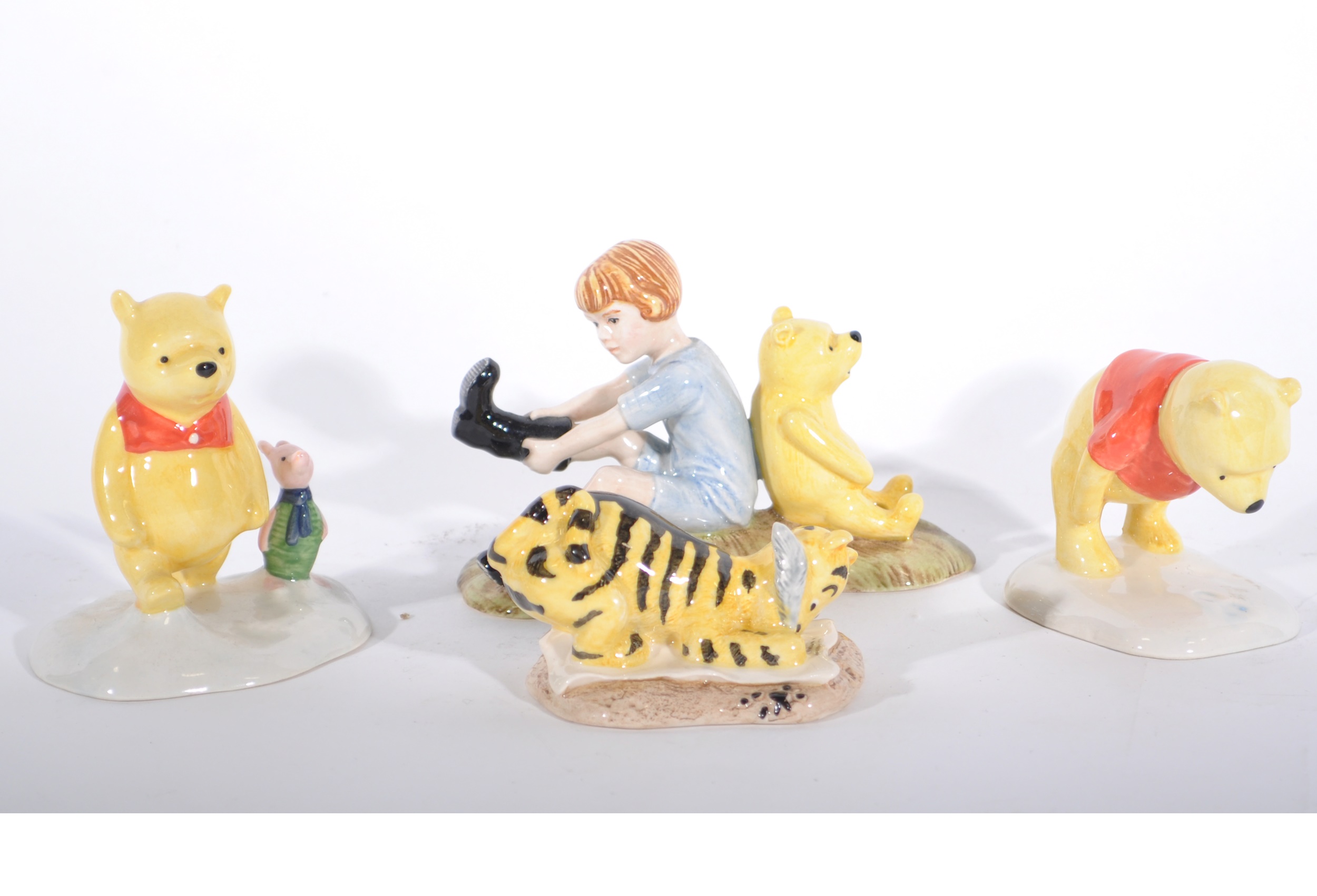 Nine Royal Doulton "Winnie The Pooh" collection figurines, all boxed