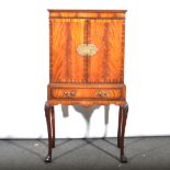 A mahogany cocktail cabinet,