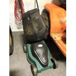 An electric lawn mower 900 watt motor.