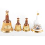 Bells Scotch Whisky Commemorative decanters; a set of graduating set of Bell decanters, etc