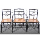 Three Regency pattern ebonised dining chairs