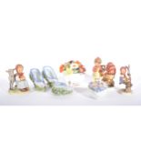 A collection of small decorative ceramics, Hummel figures by Goebel, moss ware,