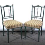 A pair of Edwardian painted salon chairs, carved crestings, turned and flut