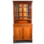 An Edwardian walnut cabinet, moulded cornice, plain frieze, glazed doors, b