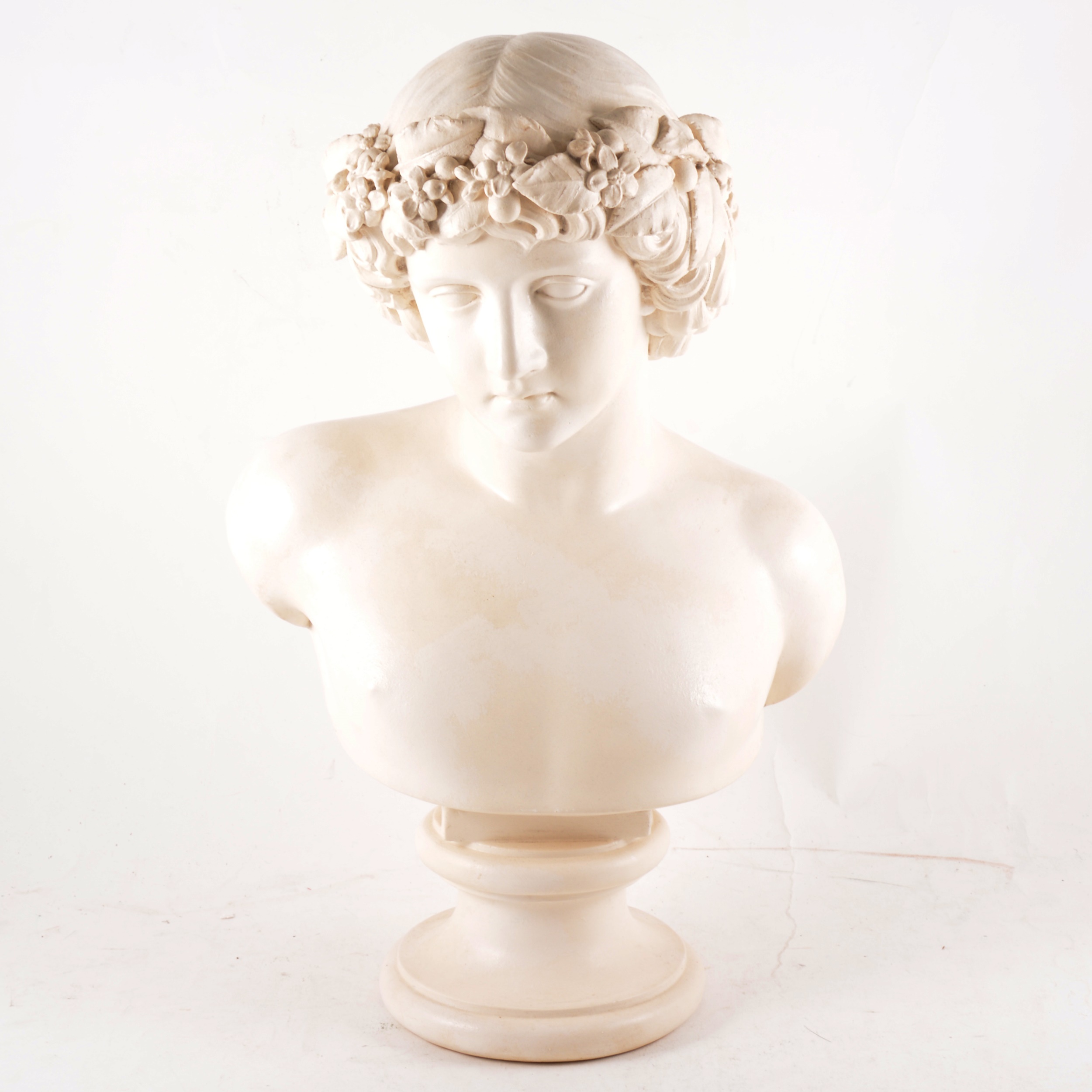 A composition white painted bust of Bacchus, 43cm.