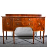 A reproduction mahogany bowfront sideboard, shallow gallery back, with two