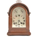 German oak cased bracket clock, arched silvered dial, signed Coxon, Notting