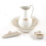 A Staffordshire four-piece toilet set, gilt decoration, comprising a ewer,