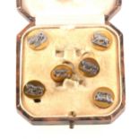 A set of six Leicester Regiment dress studs by Firmin of London, white meta