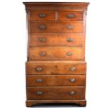 A George III oak chest on chest, dentil and cavetto cornice, fluted frieze,
