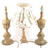 A pair of simulated marble table lamps, urn form, raised on socles, 46cm, a