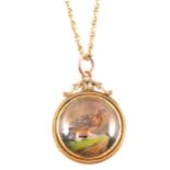 A game bird pendant and chain, the circular crystal pendant painted with a