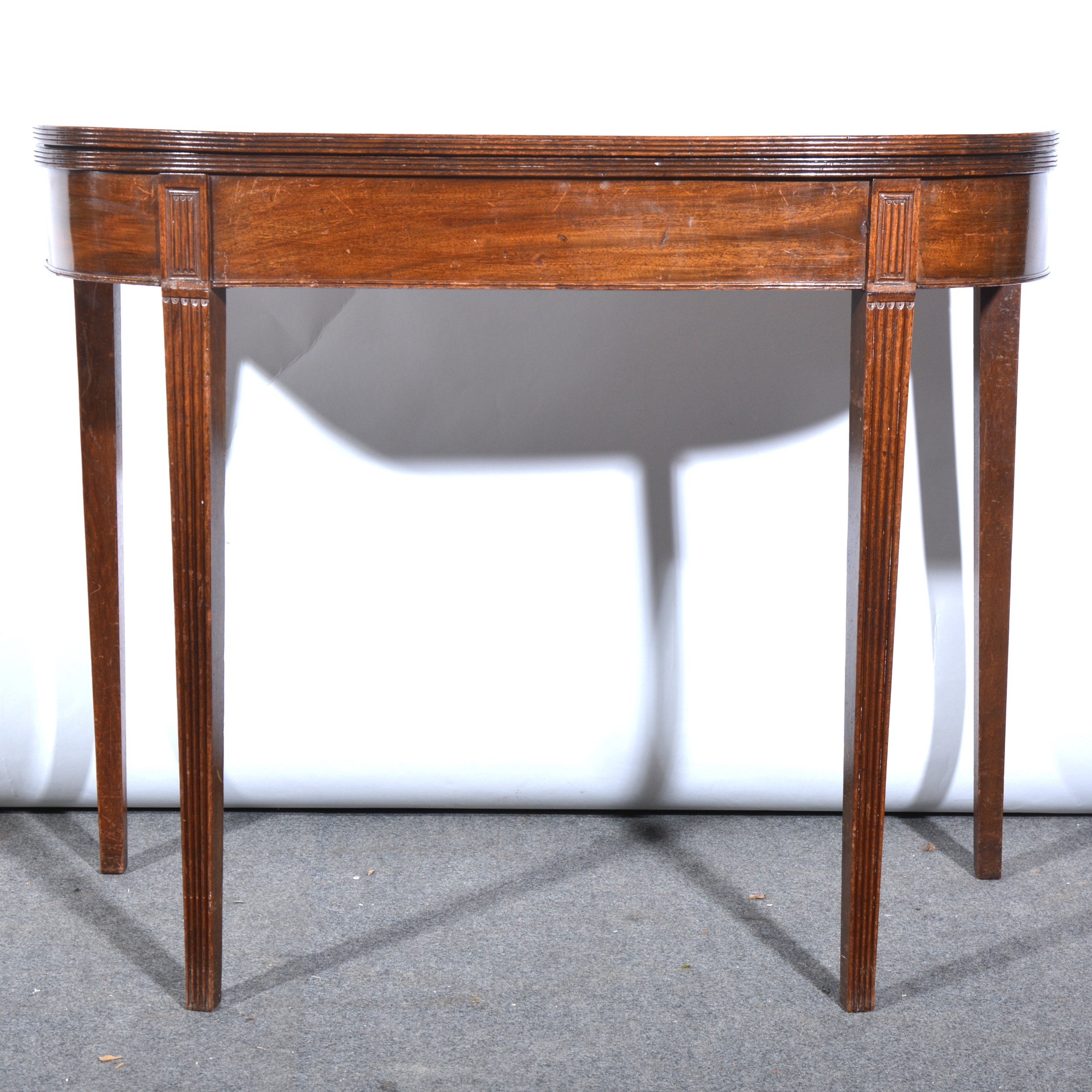 George III mahogany card table, D-shape foldover top, baize lined interior,