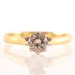 A diamond solitaire ring, the brilliant cut stone claw set in an 18 carat y