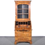 A walnut bureau bookcase, in the George I style, moulded cornice above a sh
