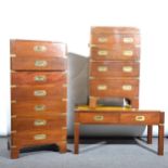 A modern mahogany and brass campaign chest, rectangular form with seven dra