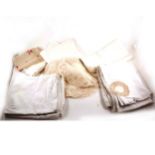 Collection of table linen, including damask table cloths, lace doilies, tra