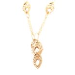 A suite of 9 carat gold jewellery, a fine trace link chain with two strands
