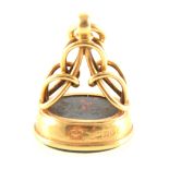 An 18 carat yellow gold seal set with an oval bloodstone intaglio carved wi