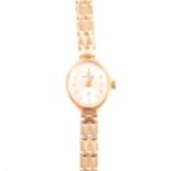 Marvin - a lady's 9 carat yellow gold bracelet watch, oval silvered baton d