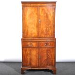 A reproduction mahogany cocktail cabinet, moulded cornice, plain frieze, up
