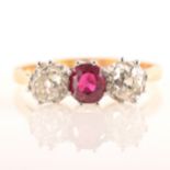 A ruby and diamond three stone ring, an oval faceted ruby 5.3mm x 4.9mm cla