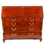 A George III mahogany bureau, fall front with inlaid banding, and stringing