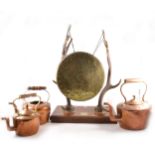 An Edwardian table gong, the brass gong supported by metal-tipped antlers,