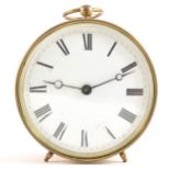 A brass drum-cased clock, white enamelled dial, 11cm.