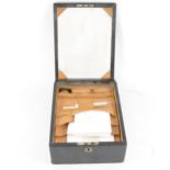 A lady's leather bound travelling stationery case, the fold down front havi