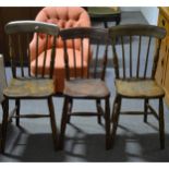 A harlequin set of eight elm and beech kitchen chairs.