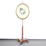 A pole-screen, replaced oval panel with gros point needlework, Regency trip