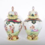 A pair of Viennese style baluster shaped covered vases, transfer printed de