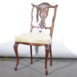 An Edwardian walnut bedroom chair, carved and pierced back, reupholstered g