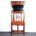 An Edwardian walnut hallstand, with an arrangement of six hooks surrounding