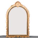 A reproduction gilt overmantel mirror, arched bevelled plate, width 97cm, h