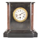 A Victorian black marble mantel clock, case of breakfront form with rouge s