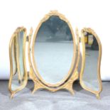 A gilt triptych dressing table mirror, oval plates, 59cm.