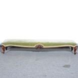 A Victorian walnut longstool, on French cabriole legs, green upholstered pa