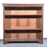 A walnut open bookcase, rectangular top with a moulded edge, plain frieze,