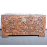 Singapore carved camphor wood chest, rectangular on block feet, carved all
