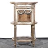 A French silvered gesso bookstand, of oval section, cane work panels, width