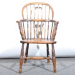 A small ash and elm Windsor chair, hoop back with turned spindles, boarded
