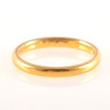 A 22 carat yellow gold wedding band, 2.5mm wide D shape, plain polished fin