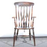 A Victorian beech farmhouse elbow chair, broad cresting, slat back, shaped